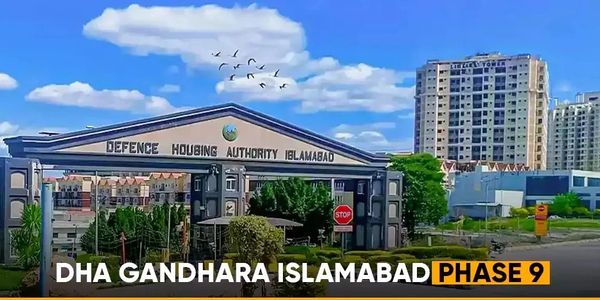 Main entrance of Defence Housing Authority Islamabad with high-rise buildings in the background.