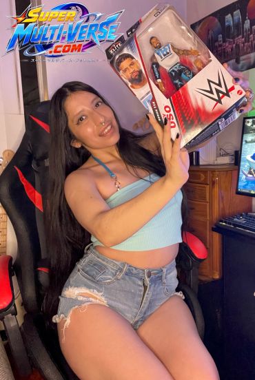 Woman holding a WWE action figure in a gaming chair.