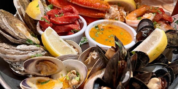 snpw crab and mixed seafood, oysters, clams, mussels wild shrimps steamed and tossed in cajun spices
