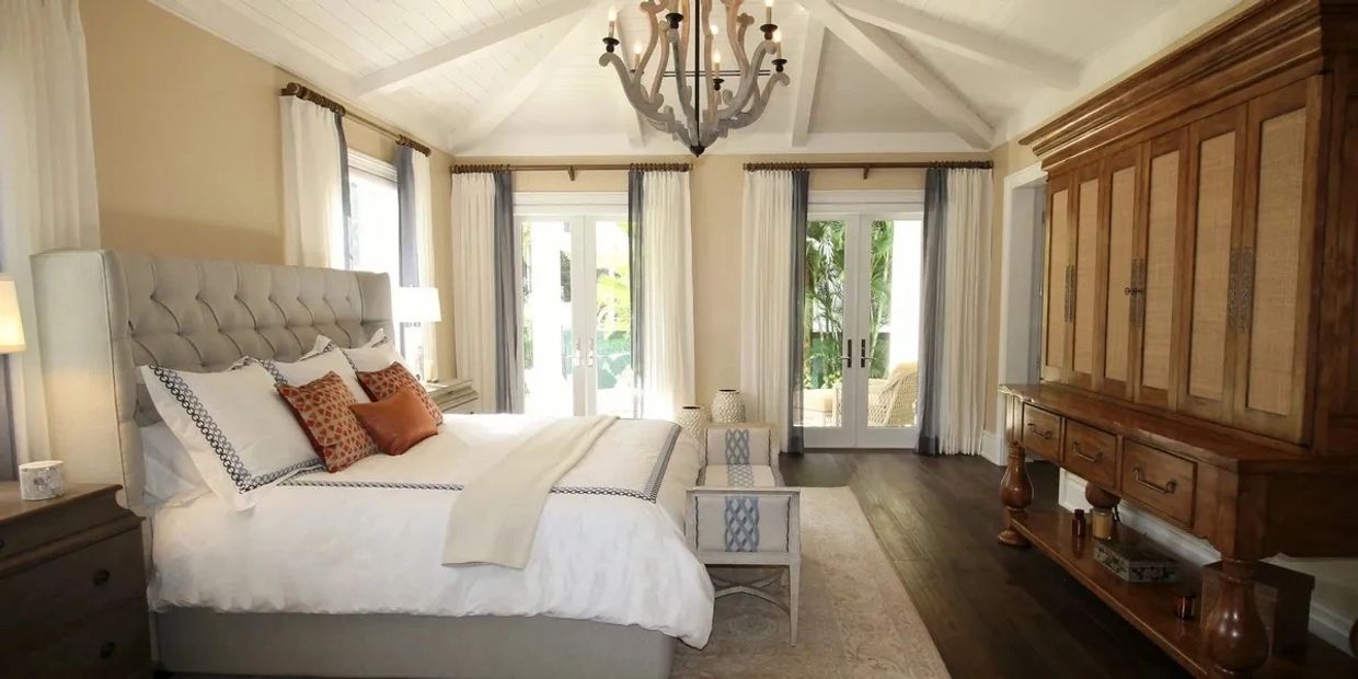 Elegant bedroom with wooden cabinet and light bedding.