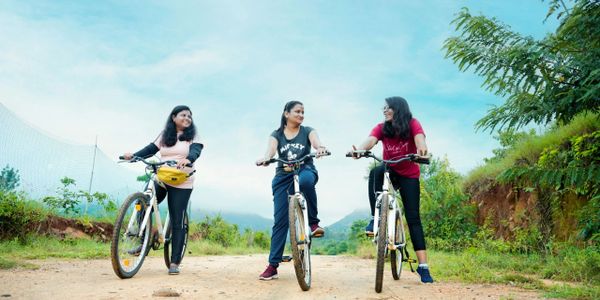 Guests at Namooru Hillview Resort with bicycles, ready to explore the scenic trails 