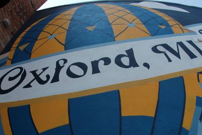 Mural with the text 'Oxford, MI' and a colorful geometric design.