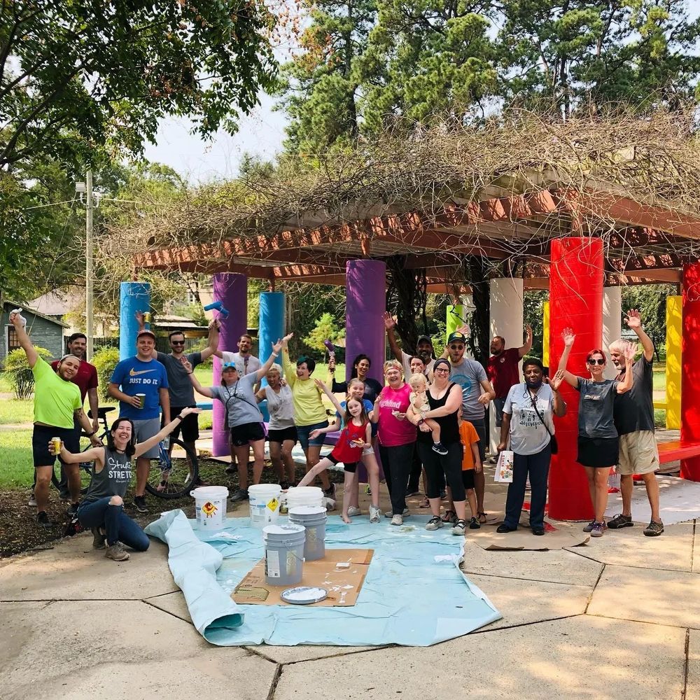 Highland neighbors paint the pergola in Shreveport's Columbia Park. 