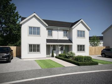 Modern two-story white house with a neatly landscaped front yard.