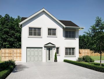Modern two-story white house with a garage and paved driveway.