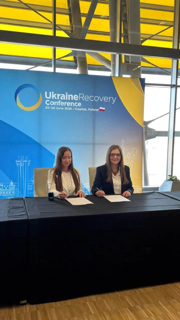 Two women sit at a table during the Ukraine Recovery Conference.