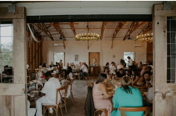 Spring Hill Barn outdoor ceremony with guests seated and view of the farm