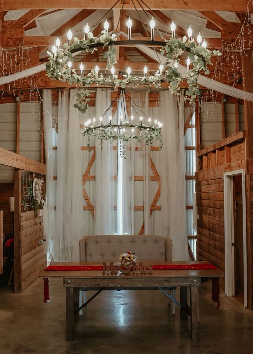 Detail shot of farmhouse tables and crossback chairs at Spring Hill Barn