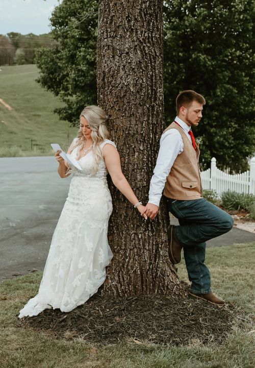 Spring Hill Barn wedding reception with string lights and farmhouse tables