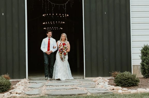 Spring Hill Barn interior showing exposed wooden beams and warm lighting