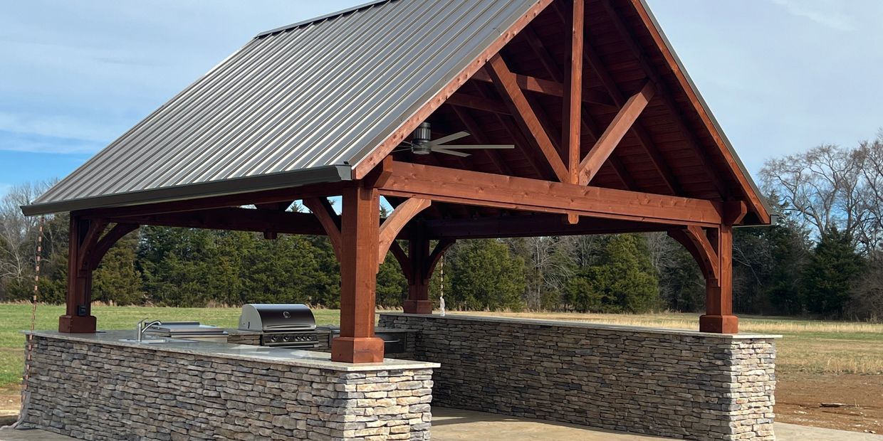 Outdoor pavilion with stone veneer and appliances