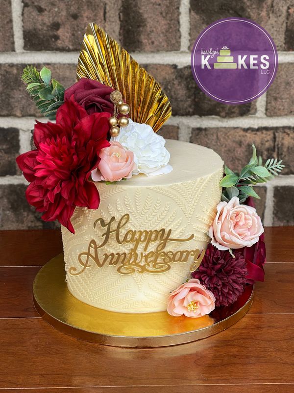 buttercream stencil red flowers gold palm leaf anniversary cake