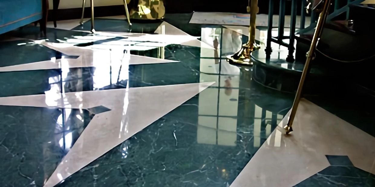 Travertine and Connemara Green marble floor at Marco Island Yacht Club.