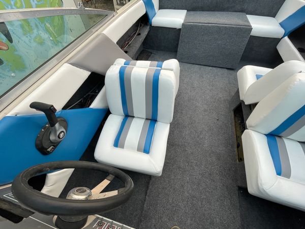 blue, white, and grey upholstered boat seats