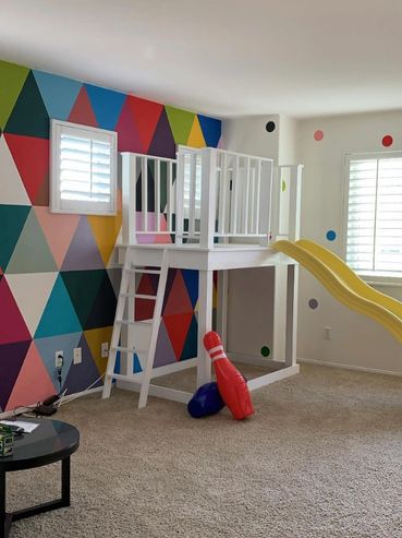 Custom children’s room mural with colorful geometric artwork and playful design
