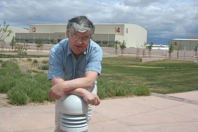 Rick Reichman leaning on light post outside of a hollywood studio.