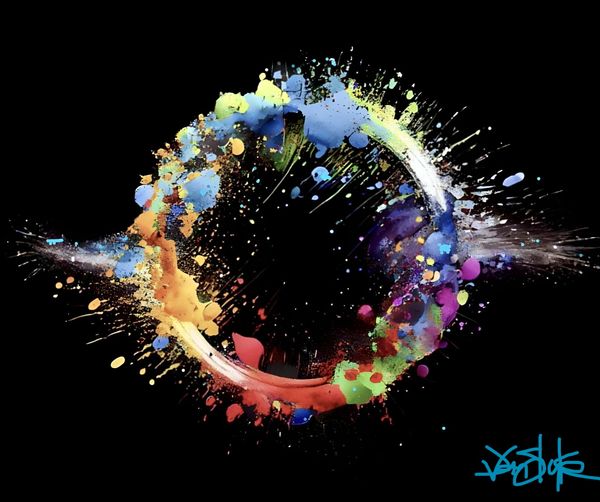 Vibrant circular splash of multicolored paint on black background.