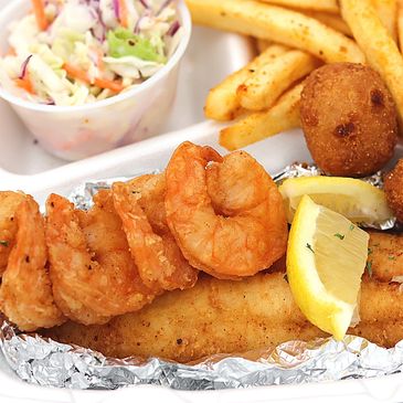 Fried fish and shrimp platter with coleslaw, French fries and hushpuppies