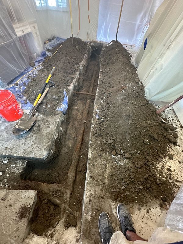 broken drain pipe that ran in the middle of customer's house. opened concrete to access for repair.