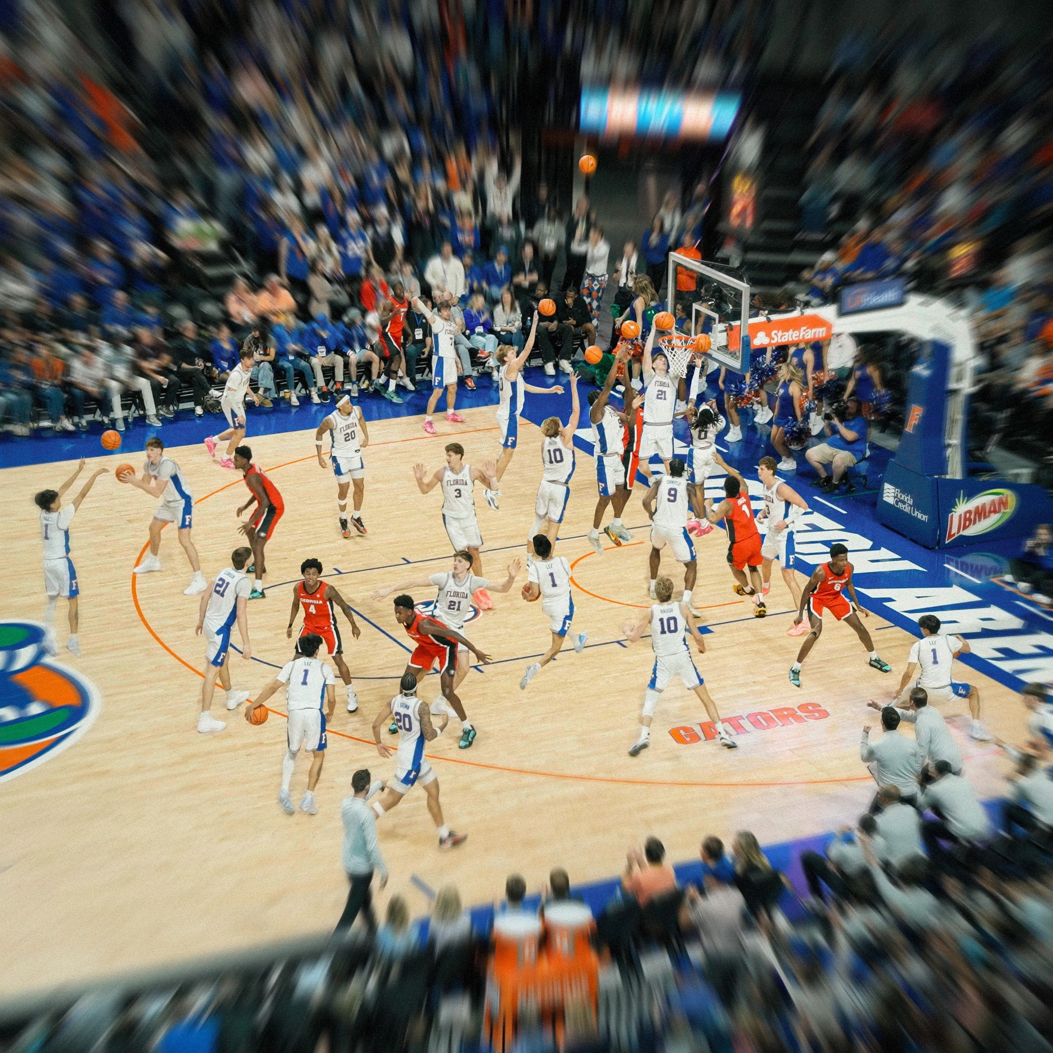 Dynamic college basketball game with Florida Gators players in action.