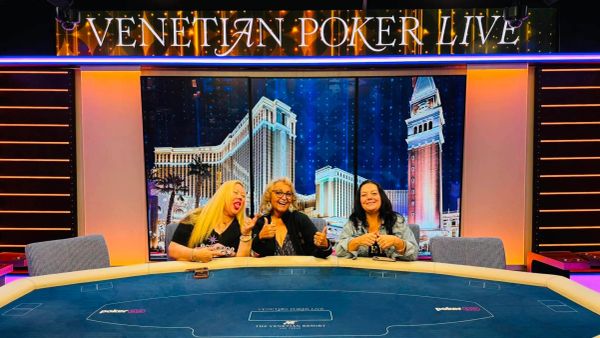 Three women smiling at a Venetian Poker Live table.