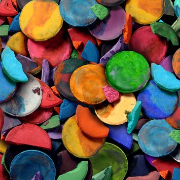 photo of water color paints in a pile.