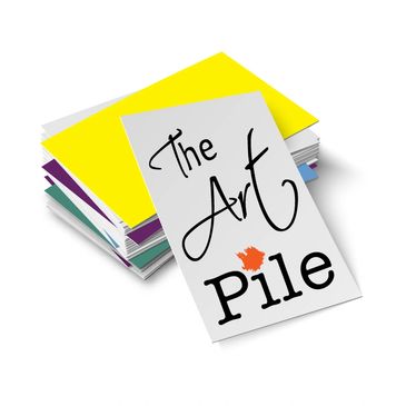 photo of the art pile logo. A stack of papers with colors mixed in.