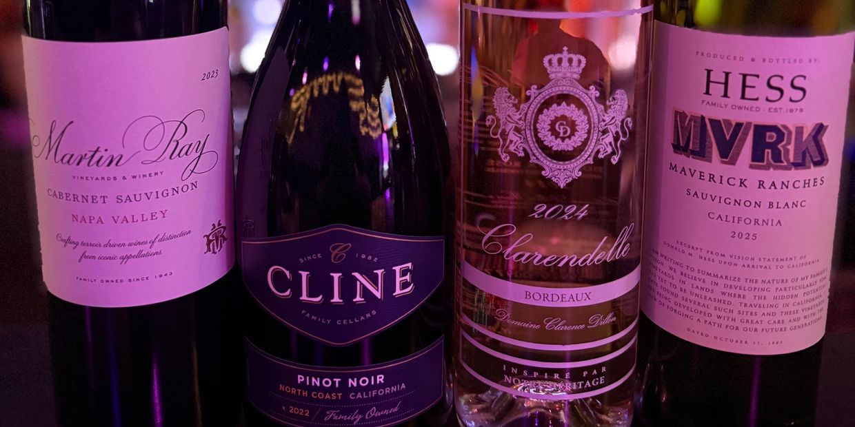 Four wine bottles with distinct labels from Napa Valley, North Coast California, Bordeaux, and California.