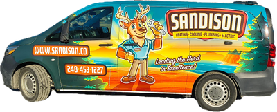 Colorful Sandison service van with a deer mascot and contact info.