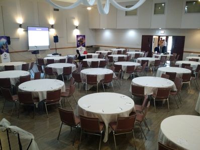 Class room style seating at round tables.