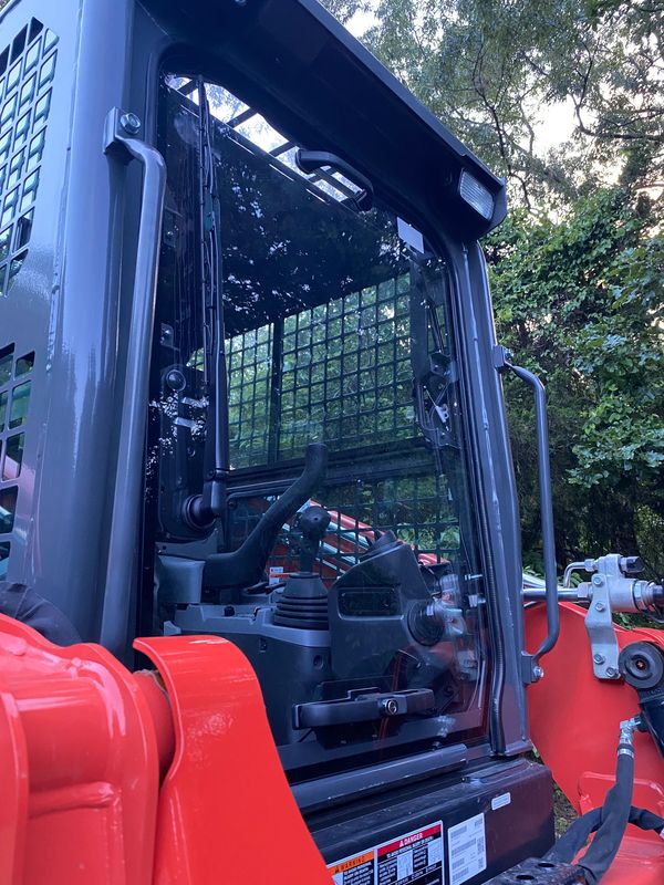 Skid steer for rent with shatter proof door