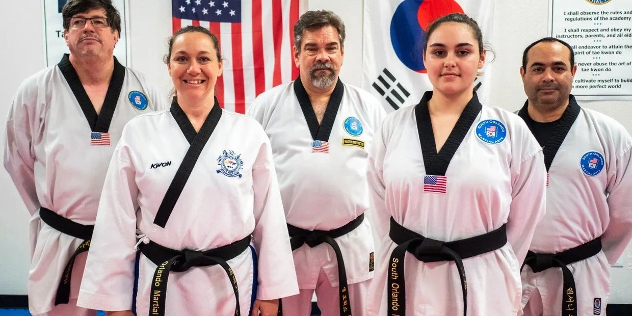 group photo of martial arts students with teachers 