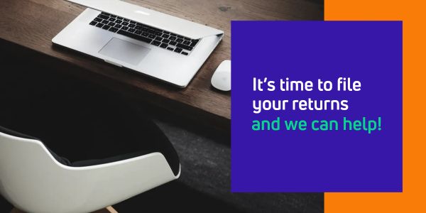Workspace with laptop and text encouraging tax return filing assistance.