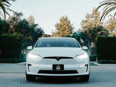 A white Tesla Model X Plaid