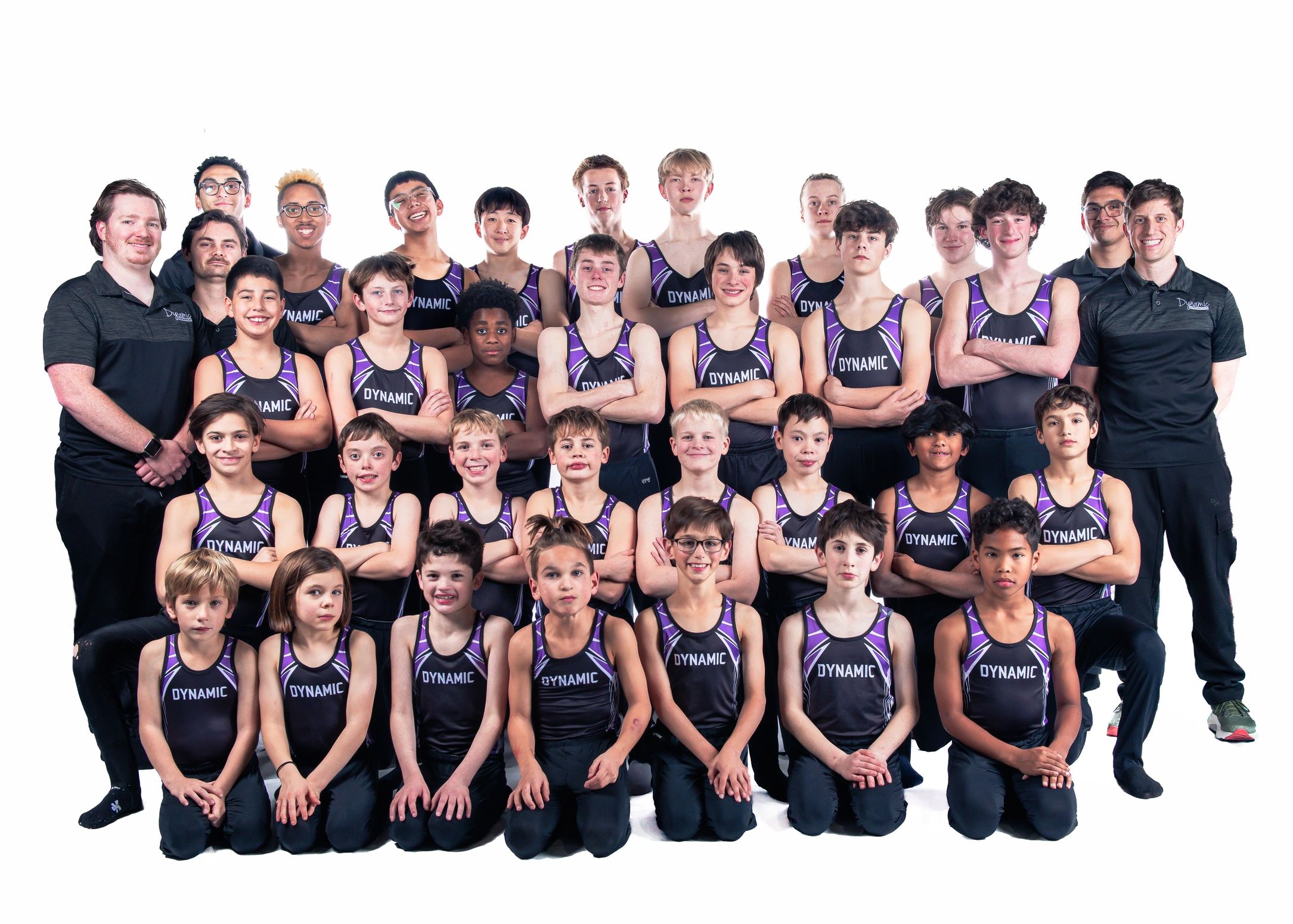 Group photo of a boys gymnastics team and coaches.