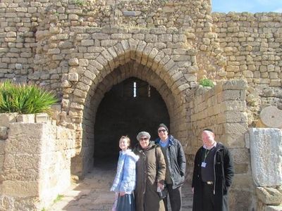 Touring Ancient Roman and Crusader ruins in Caesarea, including amphitheater and aqueduct.