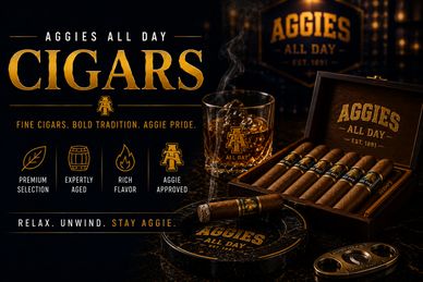 Aggies All Day cigars with glass and wooden box in elegant setting.
