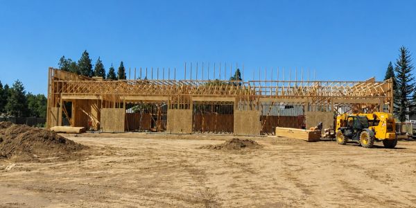 Building framework under construction on a clear day.
