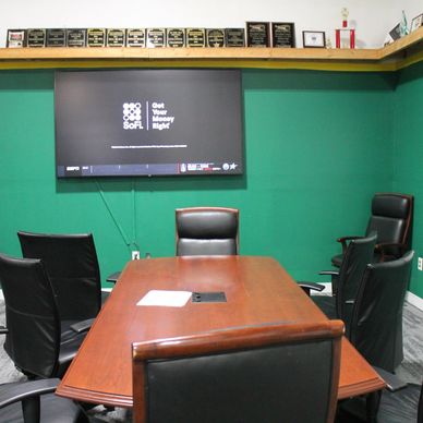 meeting area with whiteboard and tv