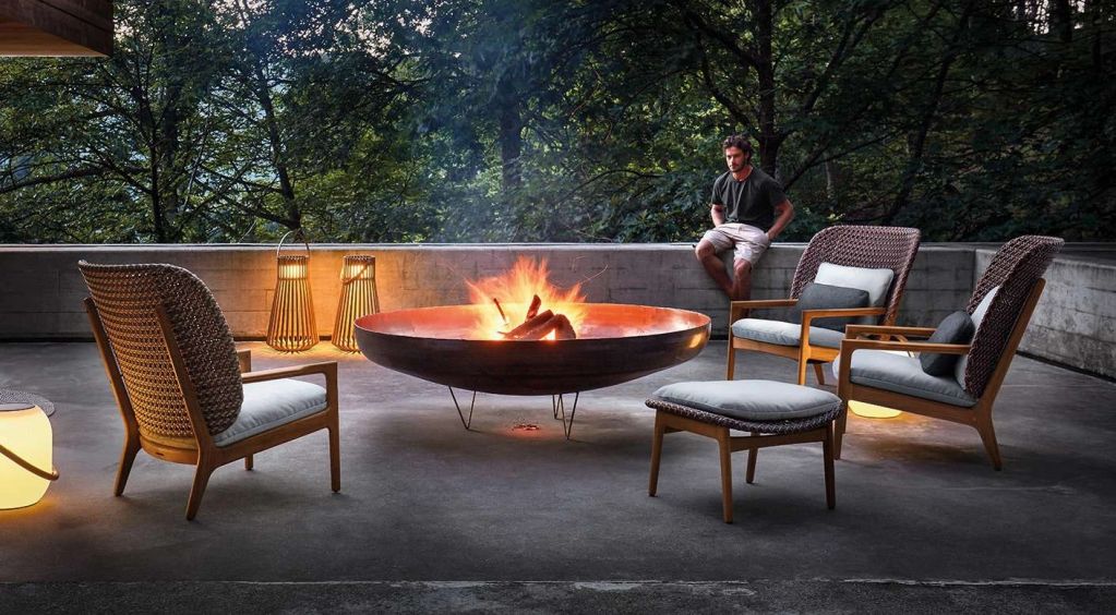 Afterglow collection — Sculpted lounge chairs and footstools in a warm, intimate setting. A pairing 