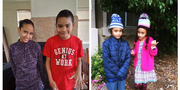 Two kids posing indoors and outdoors, dressed casually and warmly.