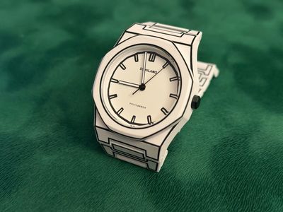 Micro and independent watch brands list. Milano D1 Polycarbon Sketch watch sitting on a green book