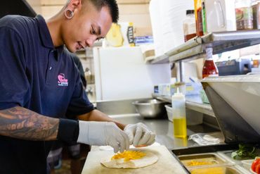 A Man Working On Food on A Plate