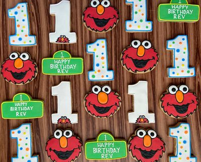 Sesame Street cookies for a first birthday. Elmo, number 1's, and Sesame Street signs.