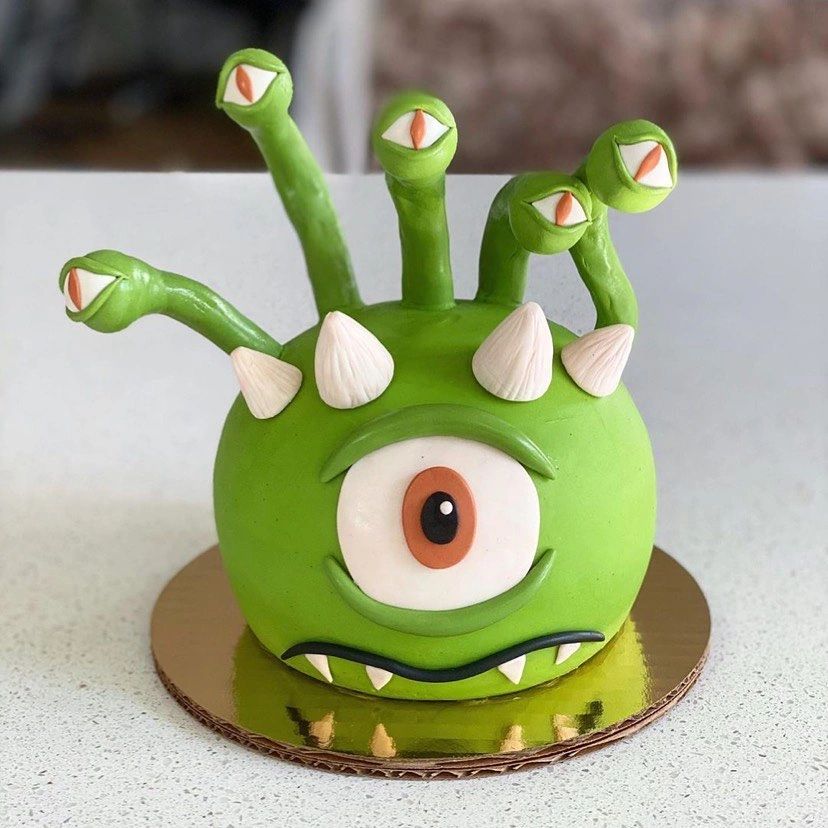 Cute green monster cake with tentacles.