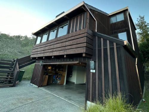 Professional seamless gutter installation on a Santa Rosa home.