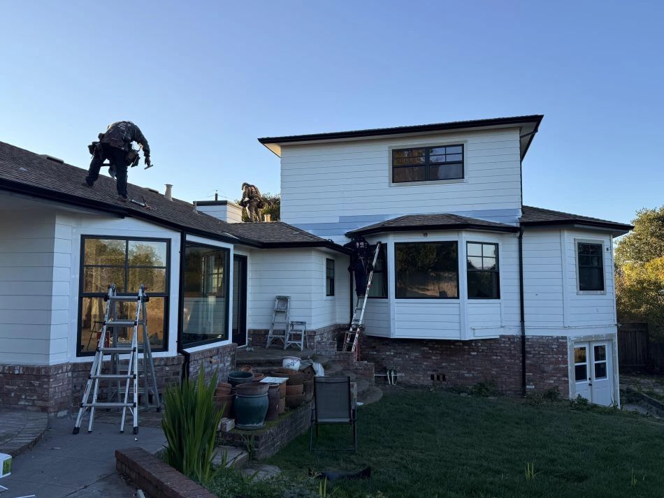 Mistah Seamless Gutters team performing a professional seamless gutter installation on a residential