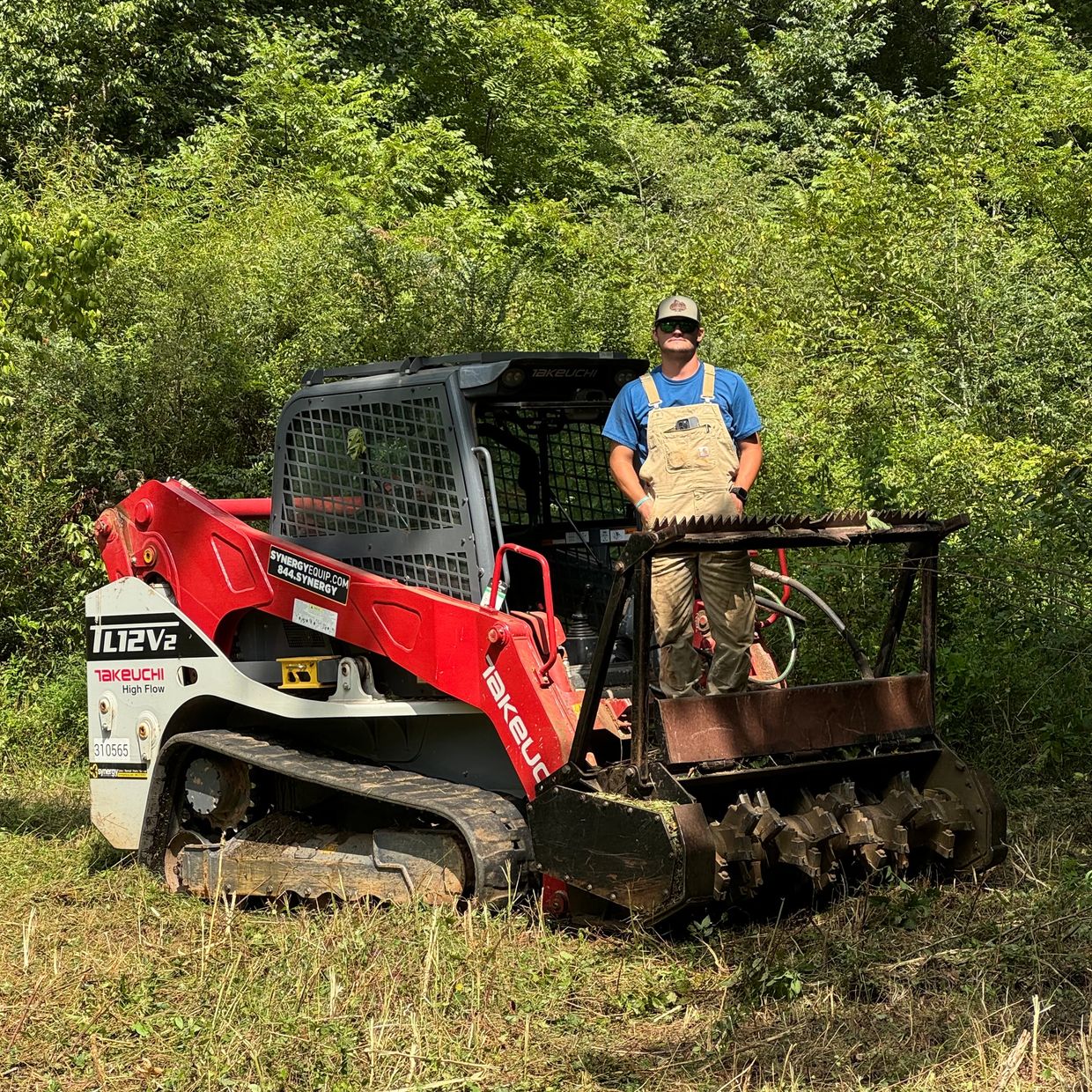 Takeuchi skid steer with a commercial forestry mulching head attached.  Ty Swanson, owner. 
