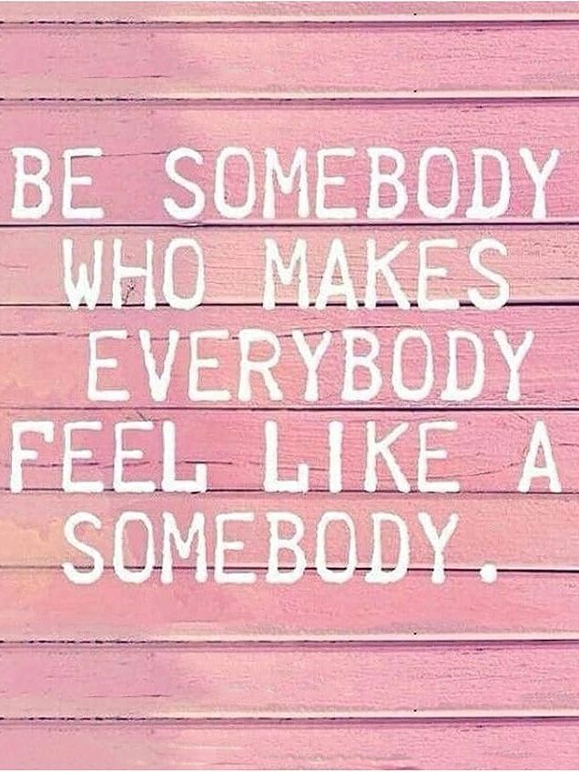 Inspirational quote on a pink wooden wall.
