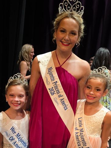 Three girls wearing crowns and sashes at a pageant event.